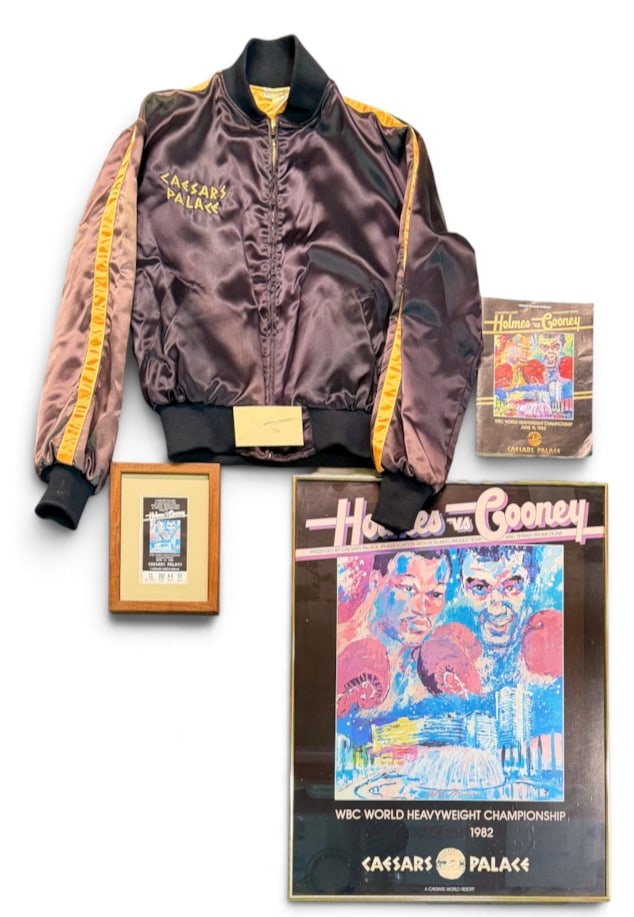 BOXING - HOLMES VS. COONEY BOXING MEMORABILIA: A NICE COLLECTION OF ITEMS RELATING TO THE WORLD HEAVYWEIGHT CHAMPIONSHIP FIGHT HELD ON JUNE 11, 1982 BETWEEN CHAMPION LARRY HOLMES AND CHALLENGER GERRY COONEY HELD AT CAESARS PALACE IN WHICH HOLMES