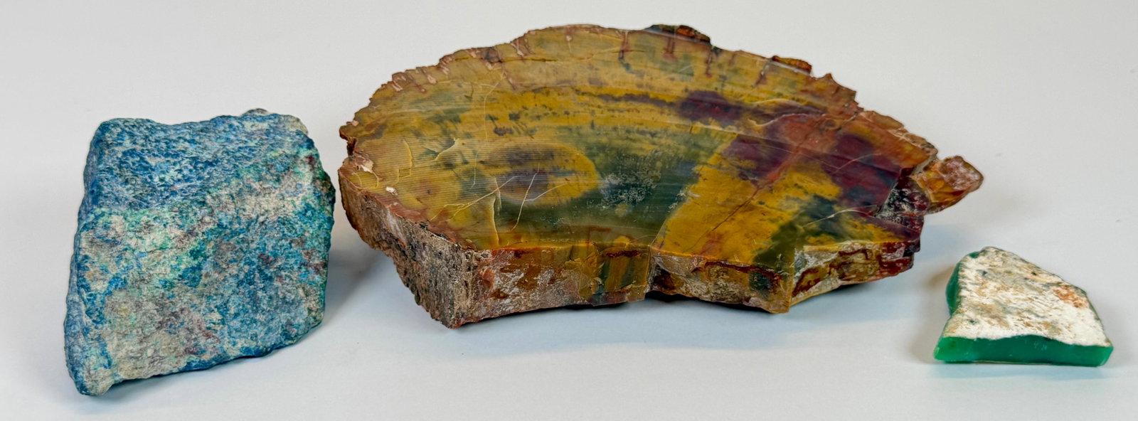 TRIO OF GEMSTONE FRAGMENTS: LAPIS LAZULI, AVENTURINE, WOOD SLICE. LARGEST IS 6"X10"