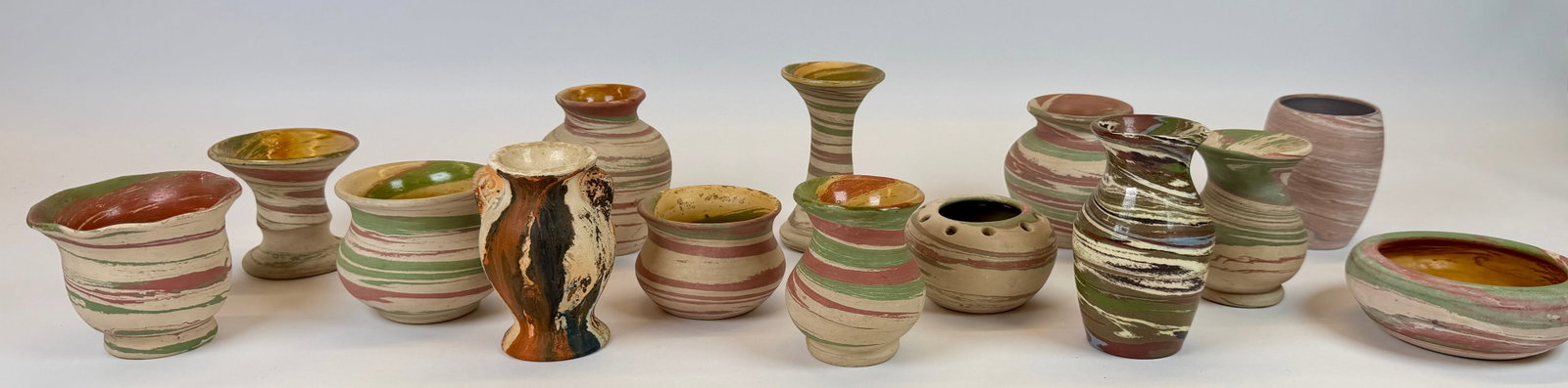COLLECTION OF SWIRLED CLAY POTTERY: SILVER SPRINGS, TICONDEROGA, DESERT SANDS AND OTHERS. AVERAGE APPROX. 4"H