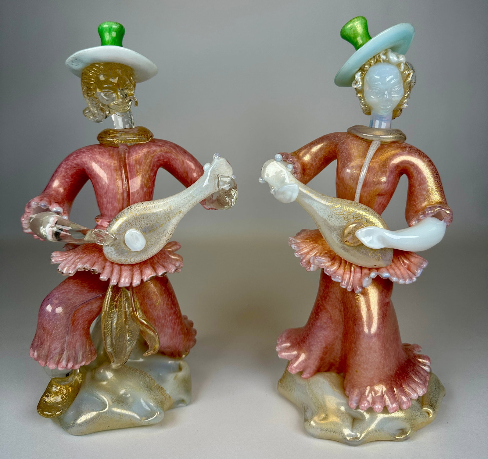 MURANO ART GLASS FIGURES: MUSICIANS. OPALINE, PINK AND GREEN GLASS WITH GOLD AVENTURINE. 11"H. REQUIRES THIRD PARTY SHIPPING.