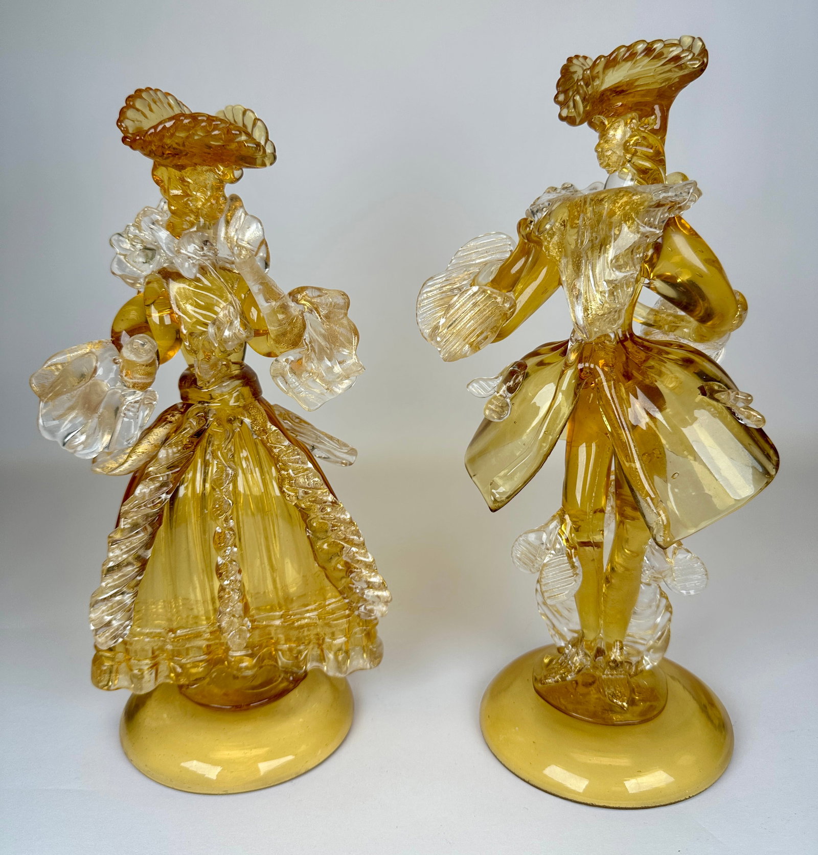 TOFFOLO (ATTR.) MURANO ART GLASS FIGURES: AMBER AND CLEAR GLASS WITH GOLD AVENTURINE. 13"H. REQUIRES THIRD PARTY SHIPPING.