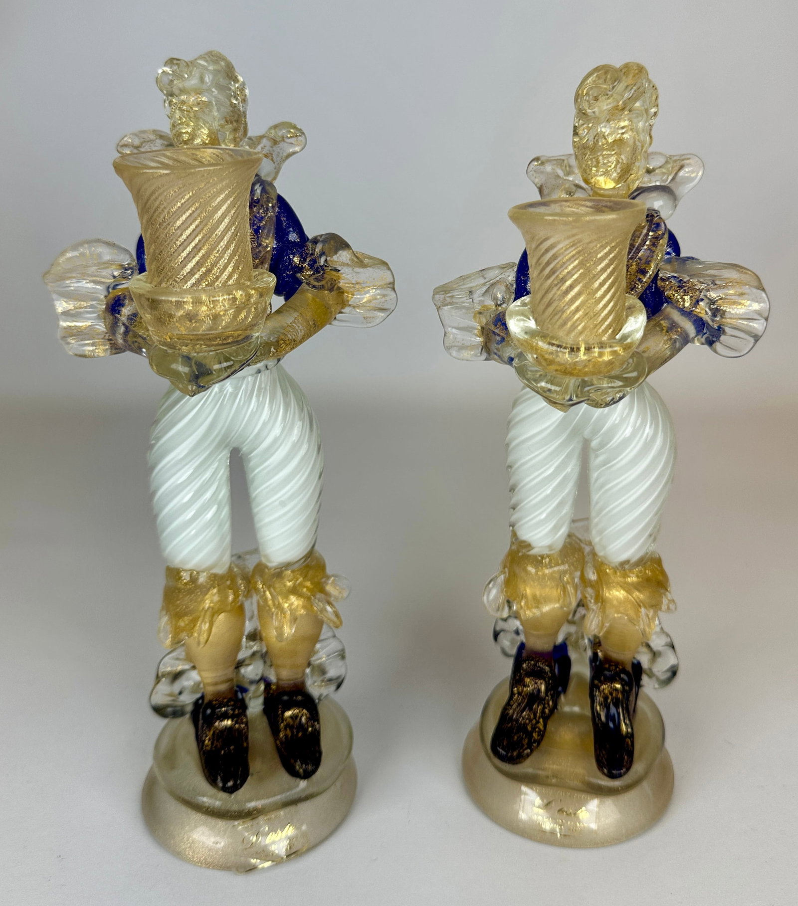 MURANO ART GLASS CANDLEHOLDER FIGURES: BLUE AND WHITE GLASS WITH GOLD AVENTURINE. LABELED. 10"H. REQUIRES THIRD PARTY SHIPPING.