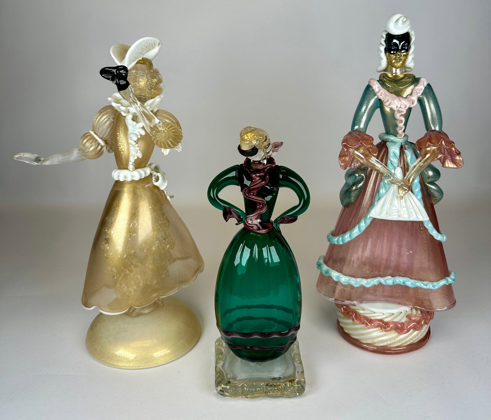 MURANO ART GLASS MASQUERADE FIGURES: MULTI-COLORED GLASS WITH GOLD AVENTURINE DETAILS. 12"H. REQUIRES THIRD PARTY SHIPPING.
