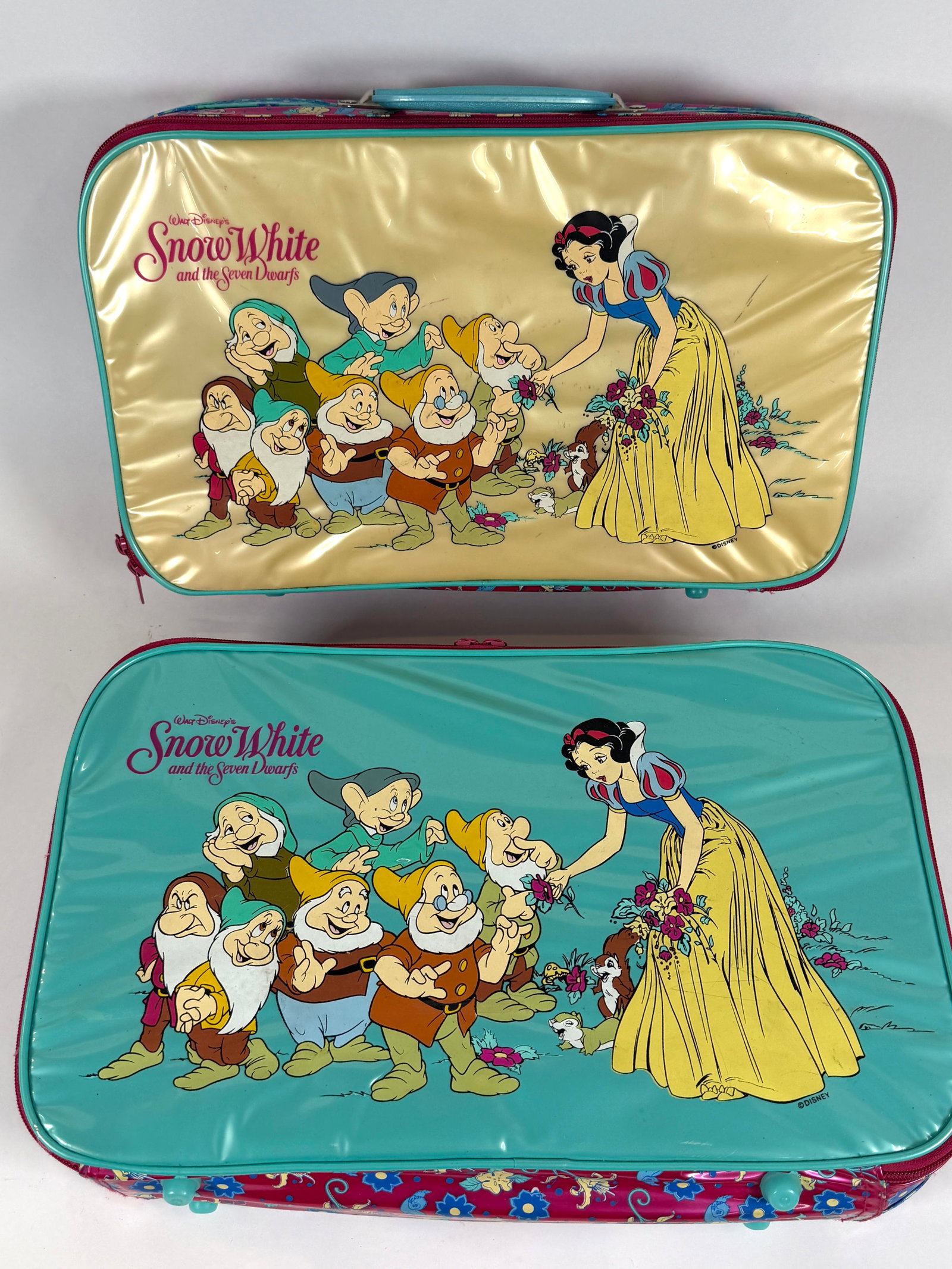 VINTAGE DISNEY SNOW WHITE SUITCASES: PAIR OF JUVENILE TRAVEL SUITCASES, SNOW WHITE AND THE SEVEN DWARVES. EACH APPROX. 11"X17"X4"