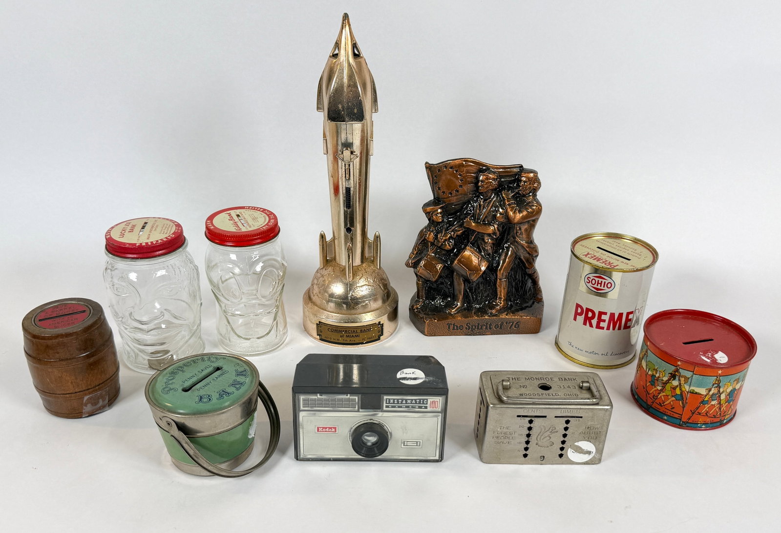 GROUPING OF NOVELTY COIN BANKS (1 of 1)