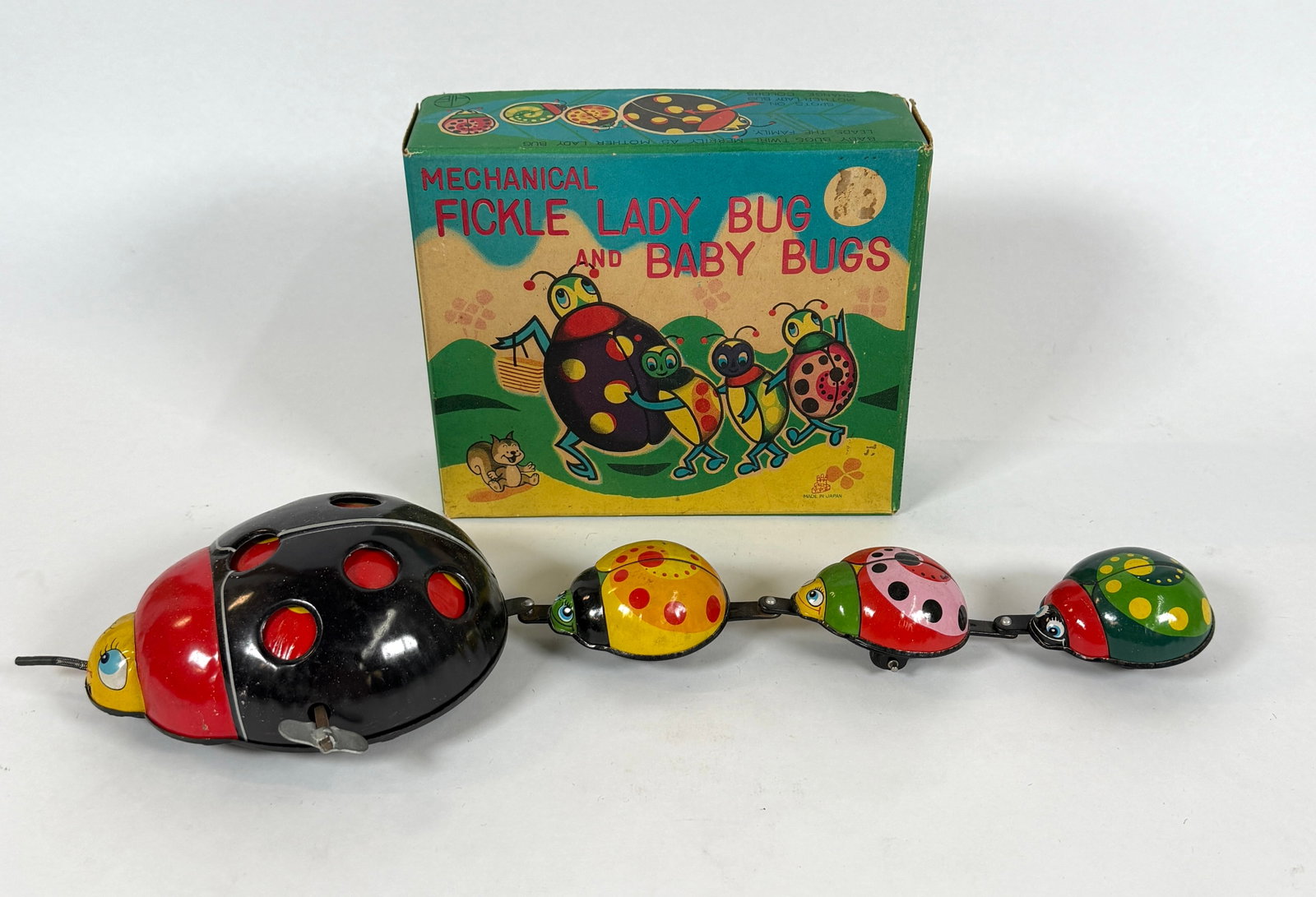 TPS JAPAN TIN LITHO MECHANICAL LADY BUG BABY BUGS: WITH ORIGINAL BOX. CARTON IS 8"X7"X3"