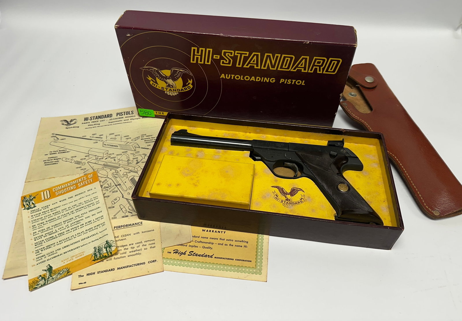 HI-STANDARD SUPERMATIC TOURNAMENT MODEL 103 PISTOL: .22 CAL TARGET PISTOL, SERIAL 1246617. INCLUDES ORIGINAL BOX, WARRANTY CARD, PARTS GUIDE, CATALOG AND LEATHER HOLSTER. EXCELLENT CONDITION. CATALOG #9271.