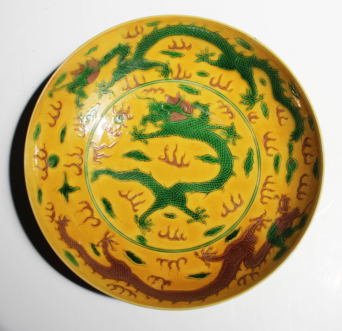 A Chinese Qing Dynasty Yellow Glaze Dragon Plate (1 of 10)