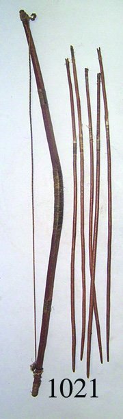 PLAINS BOW AND FIVE ARROWS: PLAINS BOW AND FIVE ARROWS ca. 1880-90'S stained red, sinew wrapped, 27" long wood tipped arrows, 34" long bow.