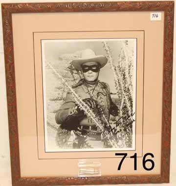 WESTERN PHOTOGRAPH: ca. 1981 Photo of Clayton Moore portraying Lone Ranger, signed and dated, has silver bullet made by Edward Bohlin Co.