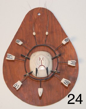 MASK: ESKIMO . mini, carved ivory, 2 color scrimshawed design, plaque is 12" x 9", 9" x 8" mask. This item dose not have a signature, hallmark, or a letter stating whom the maker/artisan is. We have been in