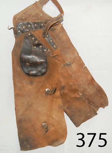 WESTERN CHAPS: ca. 2ND Q 20TH CENT. batwing style, black leather pockets, waistband, nickel studs, 35" long.