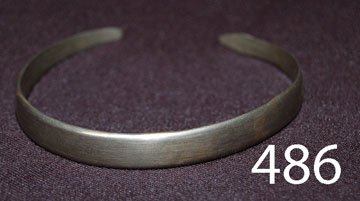 NAVAJO BRACELET: ca. 3RD Q 20TH CENT. snake design, filed & stamped design, 1 1/8" opening, 7.5" around, .25" wide.