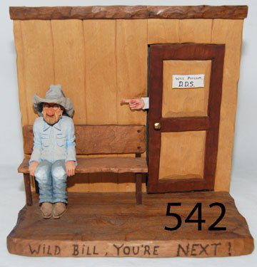 WESTERN SCENE: ca. LAST Q 20TH CENT. wood carving titled "Wild Bill Your Next", by Gene Zesch, bought at Trailside Gallery in AZ, 10.5" x 11" x 5.5".