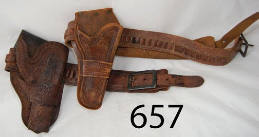 TWO GUN BELT: ca. 2ND Q 20TH CENT. single loop stamped design of horse & rider, single loop holster leather dry, 36" belt, 37" belt.