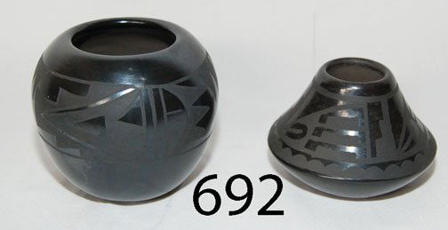 TWO POTTERY JARS: ca. LAST Q 20TH CENT. matte on black design, signed Lucy M., Santa Clara matted on black signed Flora & Gilda Naranjo, 3" x 4.5" & 4" x 4.5".