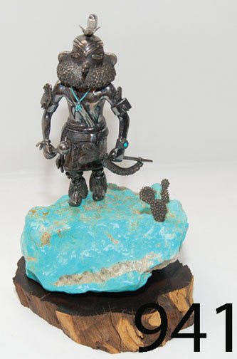 SCULPTURE: ca. LAST Q 20TH CENT. sterling silver kachina with Remouahh mask, real turquoise heshi necklace & silver cactus. mounted on large turquoise nugget by Carol Sues, 8.75" x 6".