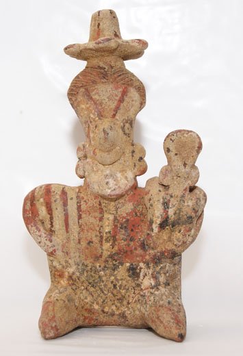 NAYARIT POTTERY FIGURE: 200 AD seated female holding baby, painted design, ex Hubert Guy collection, 6.5" tall Shipping charge on this item is $10.00. Unless noted all items have s