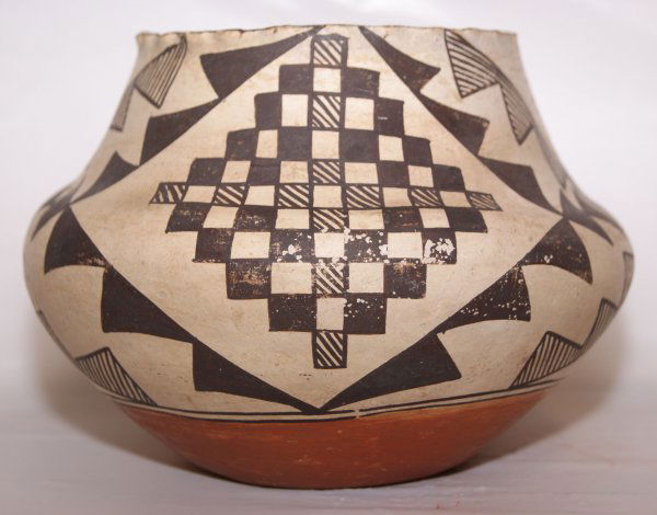 ACOMA POTTERY JAR: 1960'S black on white design, pie crust rim, minor rubs, 5.5" x 7"Shipping charge on this item is $10.00.Unless noted all items have some amount of acceptable wear, scratches, nicks, missing stitches,
