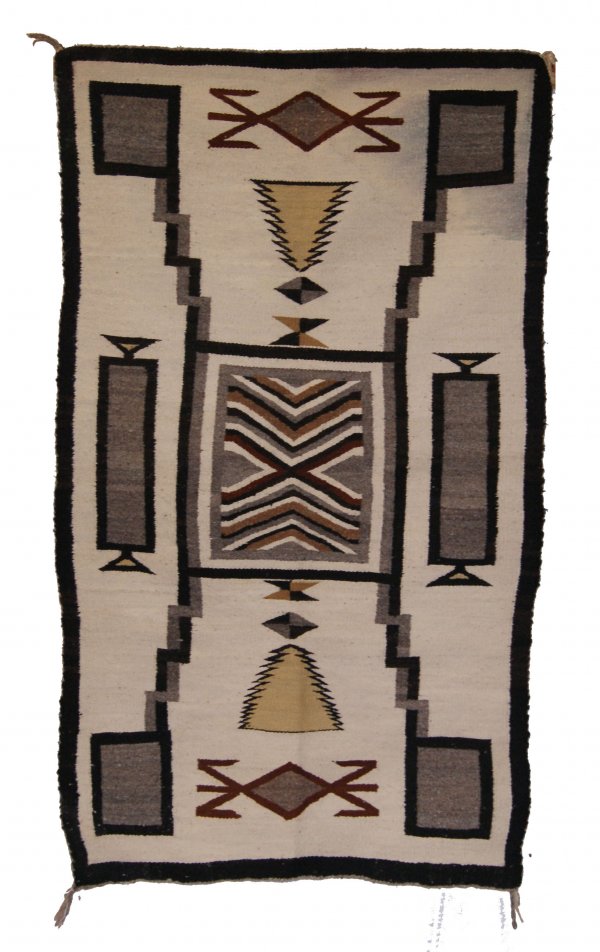 NAVAJO TEXTILE: 1960'S storm pattern with water bugs, has stains, 60" x 34" Shipping charge on this item is $20.00. Unless noted all items have some amount of acceptable wear, scratches, nicks, missing stitches, ect.