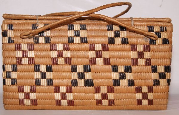 SALISH LIDDED BASKET: 1920'S checker board dsign, minor loss of stitches, 7" x 8" x 13"Shipping charge on this item is $20.00.Unless noted all items have some amount of acceptable wear, scratches, nicks, missing stitches,