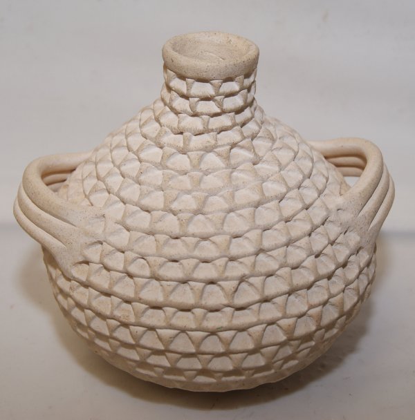 Acoma pottery vase: 1970's corrugated design, signe S. Shutiva, 5" x 5" Shipping charge on this item is $10.00. Unless noted all items have some amount of acceptable wear, scratches, nicks, missing stitches, ect. for the