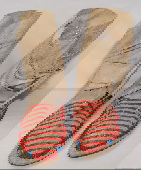 Plains Moccasins: 1940's quilled and beaded design on hide, 12" x 4" x 9"Shipping charge on this item is $10.00.Unless noted all items have some amount of acceptable wear,