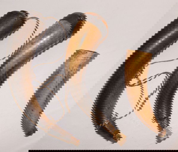 Three Western Powderhorn's: 1890s made from cow horn with wood plugs largest, 12" x 3" smallest 8" x 2.5"Shipping charge on this item is $10.00.Unless noted all items have some amount of acceptable wear, scratches, nicks, missin