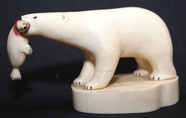 Eskimo Carved Ivory Figure: 1930s polar bear with seal in mouth on ivory base signed Okpealuk 2.25" x 4.25" Shipping charge on this item is $10.00. Unless noted all items have some amo
