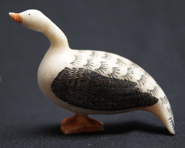 Eskimo Ivory Carving: 1940s 50s carved swan with scrimshaw feather design 2" x 2.5" Shipping charge on this item is $10.00. Unless noted all items have some amount of acceptable