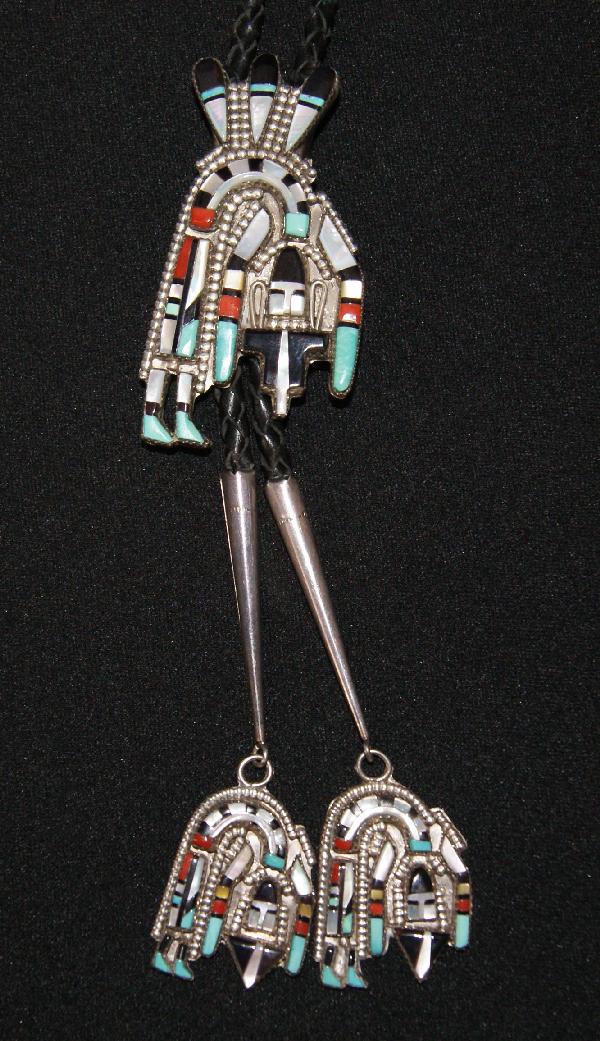 Zuni Silver Bolo: 1970s 80s sterling silver stone-to-stone inlaid bent rainbow man, with matching tips, by H. E.Cellicion 2.75 inches tall Shipping charge on this item is $1