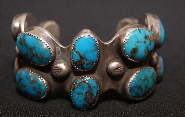 Navajo Bracelets: 1960s 70s heavy sterling Silver cluster of turquoise stones 5.5" x 1.5" x 1.25 opening Shipping charge on this item is $10.00. Unless noted all items have s