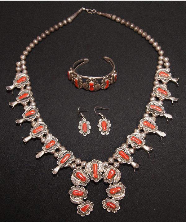 Navajo Coral Jewelry Set: 1970s 80s sterling silver squash blossom bracelets 5.25" x 1" 1 inch opening signed with Kearmys 24 inches long Shipping charge on this item is $10.00.