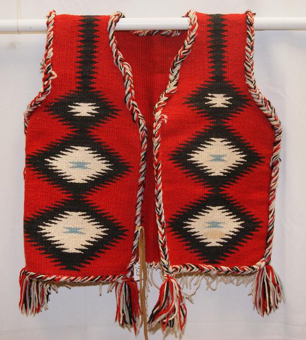 Navajo Textile Vest: 1950s 60s eye dazzler design with leather ties full size Shipping charge on this item is $10.00.