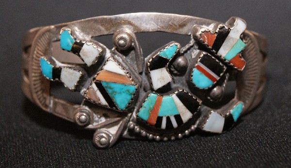 Zuni Bracelet: 1940s 50s sterling silver stone to stone inlaid band rainbow Man 5.25" x 1.25" x 1.25 opening Shipping charge on this item is $10.00. Unless noted all items