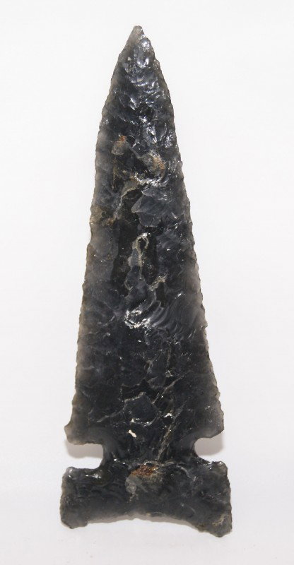 CALIFORNIA SPEAR POINT: age unknown made of obsidian, 5.25" x 1.7/8" Shipping charge on this item is $10.00. Unless noted all items have some amount of acceptable wear, scratches, nicks, missing stitches, ect. for their age.