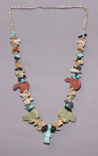 ZUIN FETISH NECKLACE: 1980s hand carved animals, 29" longShipping charge on this item is $10.00.Unless noted all items have some amount of acceptable wear, scratches, nicks, missing stitches, ect. for their age. Measuremen