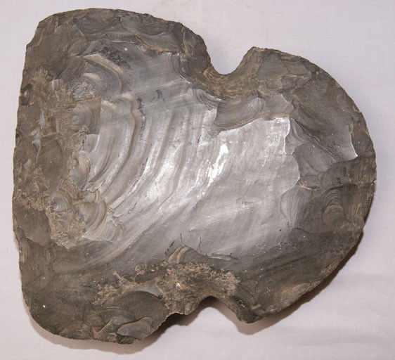 DECORATIVE AXE HEAD: age unknown made from obsidian made by Ted Orcutt has large chip, 12.5" x 11.5" x 3" Shipping charge are for the United States. The shipping on this lot is $20.00. Outside the United States there will