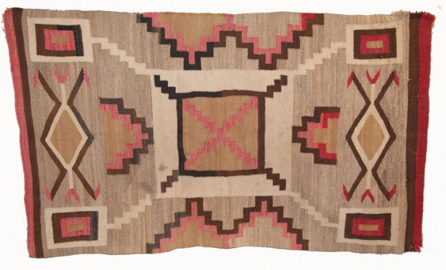 NAVAJO TEXTILE: 1920s-30s crystal storm pattern has holes and edge wear, 79" x 45" Shipping charge are for the United States. The shipping on this lot is $15.00. Outside the United States there will be additional shi