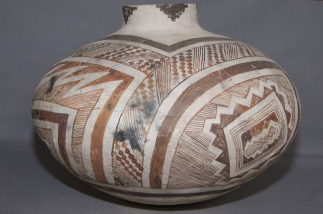 ANASAZI POTTERY OLLA: prehistoric black on white geometric design restored, 10" x 14" Shipping charge are for the United States. The shipping on this lot is $20.00. Outside the United States there will be additional shippi