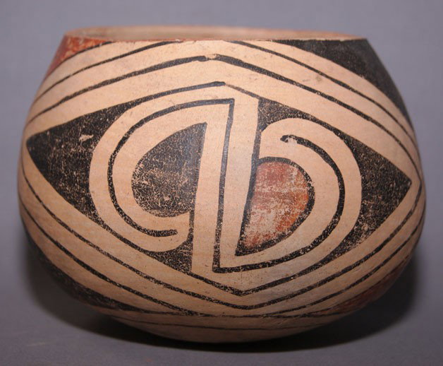 CASAS GRANDES POTTERY BOWL: prehistoric polychrome design paint has rubbing and neck has been ground down, 4.5" x 6" Shipping charge are for the United States. The shipping on this lot is $10.00. Outside the United States there 