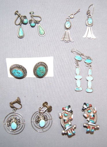 6 PAIRS OF NAVAJO/ZUNI EARRINGS: 1940s-50s sterling silver turquoise Zuni channel inlaid bent rainbow man are clip-on's the rest are Navajo, 1" x. 5" Shipping charge are for the United States. The shipping on this lot is $10.00. Outs