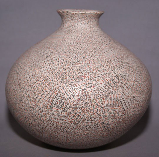 MATA ORTIZ POTTERY JAR: 1980s incised and fine line painted design Signed Aura Bugarini Cota, 6" x 6" Shipping charge are for the United States. The shipping on this lot is $10.00. Outside the United States there will be add