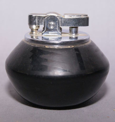 SAN ILDEFONSO POTTERY LIGHTER: 1940s-50s matte on black design signed Blue Corn 2" x 2.5" Shipping charge are for the United States. The shipping on this lot is $10.00. Outside the United States there will be additional shipping fe