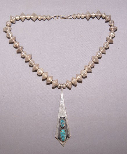 NAVAJO NECKLACE: 1970s sterling silver graduated beads shadow box with turquoise, 15" long Shipping charge are for the United States. The shipping on this lot is $10.00. Outside the United States there will be additio