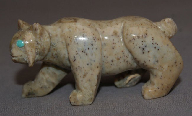 ZUNI FETISH: 1970s carved stone bobcat with turquoise inlaid eyes, 1" x 2.5" Shipping charge are for the United States. The shipping on this lot is $10.00. Outside the United States there will be additional shippi