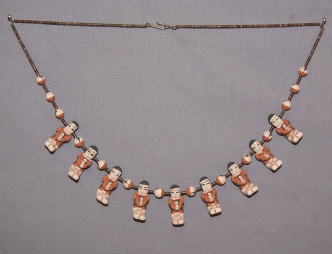 JEMEZ POTTERY NECKLACE: 1980s 90s shell heshie and pottery storytellers with pottery beads signed A.Coriz R.Barilon 23 inches long Shipping charge are for the United States. The shipping on this lot is $10.00. Outside the Un