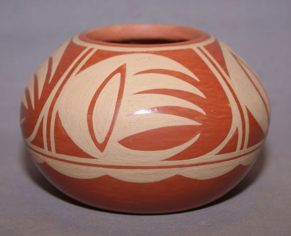 SAN ILDEFONSO POT: 1990s buff on red minor rubbing signed Albert and Josephine 3" x 4.5" Shipping charge are for the United States. The shipping on this lot is $10.00. Outside the United States there will be additional