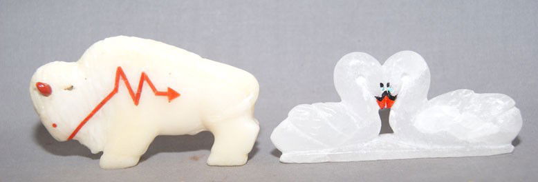 2 ZUNI FETISHES: 1990s, white buffalo with coral horns, eyes and lighting bolt 1.75" x .5" x 3", 2 swans signed Hubert Pinion 1.5" x 3.25" x .75" Shipping charge are for the United States. The shipping on this lot is