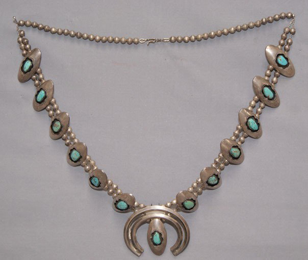 NAVAJO SQUASH BLOSSOM NECKLACE: 1960s-70s sterling silver and turquoise shadow box design 30" long Shipping charge are for the United States. The shipping on this lot is $10.00. Outside the United States there will be additional shi